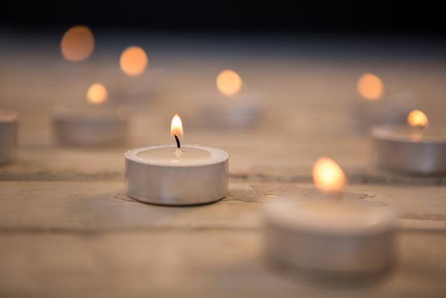 Burning Tea Light Candles on Wooden Surface - Download Free Stock Photos Pikwizard.com