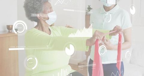 Senior woman performing resistance band rehab with caregiver while HUD monitoring wellness