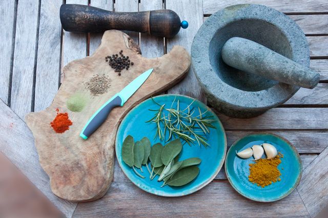 Ingredients and Utensils for Herb and Spice Preparation on Wooden Table - Download Free Stock Images Pikwizard.com