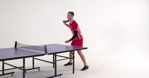 Focused Table Tennis Player Ready for Shot