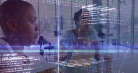 Office colleagues collaborating with technology overlay