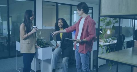 Young Professionals Discussing Ideas in Modern Office with Coffee