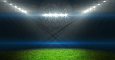 Empty sports stadium with glowing spotlights