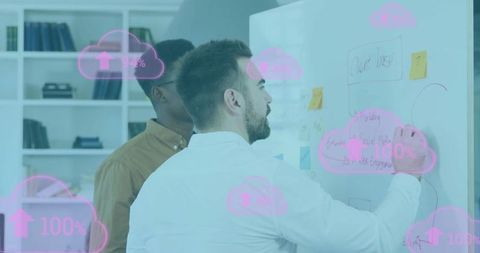 Diverse team discussing cloud computing on whiteboard