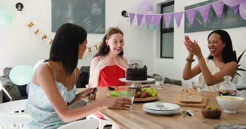 Diverse Friends Celebrating Birthday with Joyful Gathering and Cake Cutting