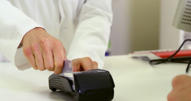 Customer paying through credit card in pharmacy