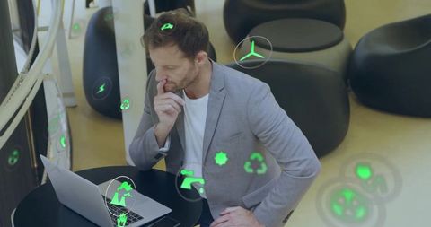 Thoughtful businessman analyzing future-forward data on laptop