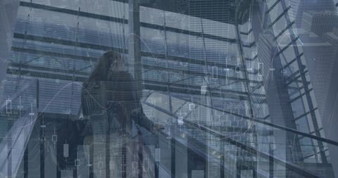 Caucasian businesswoman with digital data overlays in modern office