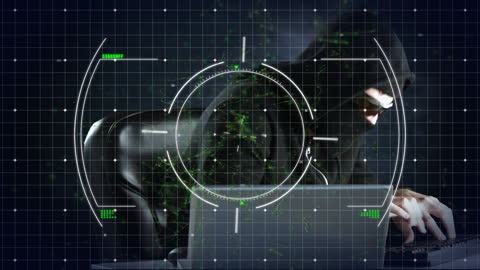 Hacker in Hood Using Laptop with Digital Effects