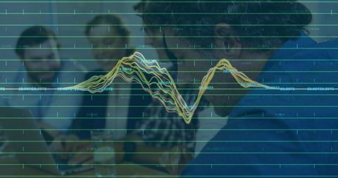 Collaborating team analyzing layered data visualization overlay while working on laptop