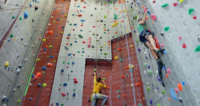 People Rock Climbing in Indoor Climbing Facility - Download Free Stock Images Pikwizard.com