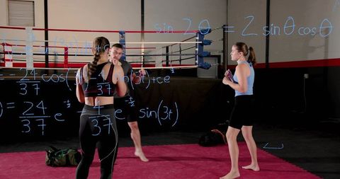 Female kickboxing coaching session with math overlay on gym ring promoting discipline
