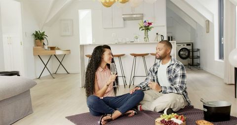 Romantic Couple Celebrating Anniversary with Wine at Home