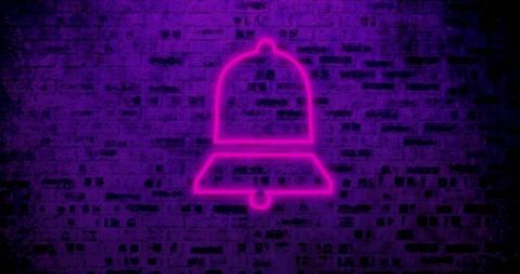 Glowing Neon Bell on Vibrant Brick Wall at Night