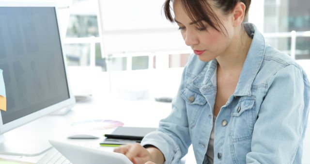 Young Professional Woman Working on Digital Tablet at Desk - Download Free Stock Images Pikwizard.com