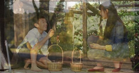 Asian Siblings Collecting Eggs in Forest-Inspired Farm Setting