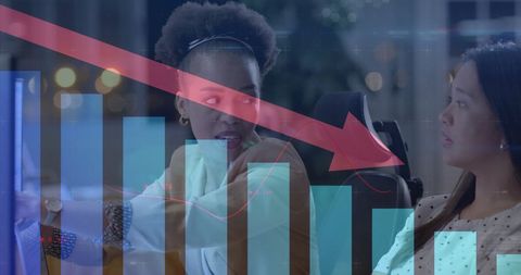 Diverse businesswomen analyzing declining financial data