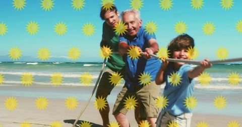 Cheerful Multi-generational Family Enjoying Tug of War on Sunny Beach