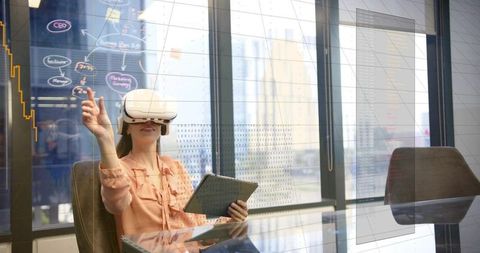 Businesswoman wearing vr headset interacting with ar analytics on glass in urban boardroom
