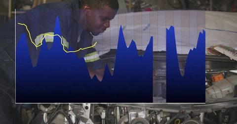 African american mechanic inspecting car engine with blue analytic overlay chart