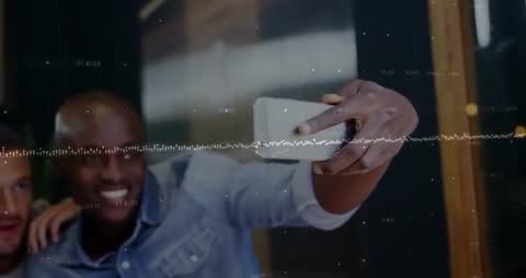 Friends Creating Smartphone Video in Modern Cafe Setting