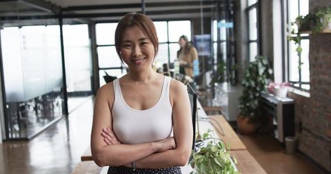 Confident Female Professional in Modern Office Environment