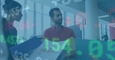 Colleagues Analyzing Financial Data with Digital Stock Overlay