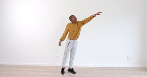 Person Stretching Arm Gracefully in Minimalist Space - Download Free Stock Images Pikwizard.com