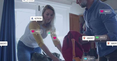 Couple packing luggage with social media notification overlays for travel and lifestyle