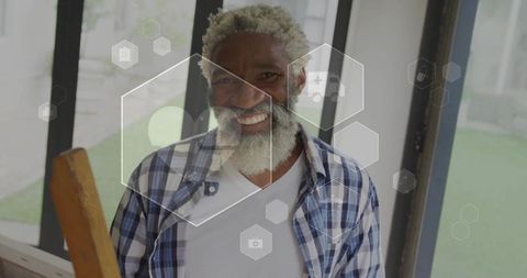 Elderly Man Enjoying Modern Sunroom with Tech Background