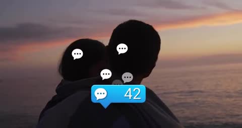 Couple Embracing on Seaside Cliff With Social Media Notification