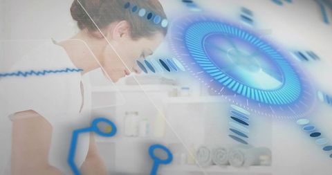 Spa therapist leaning over treatment table with futuristic blue hud overlay and rolled towels