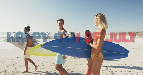 Friends Celebrating America with Surfboards on Beach
