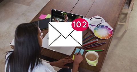 Creative professional female experiencing busy digital communication