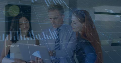 Business Team Analyzing Data with Overlay of Graphs and Charts