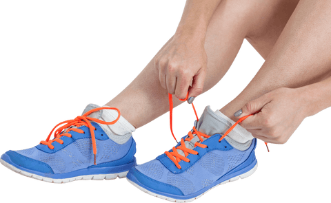 woman tying running shoes with neon orange laces on transparent background - Download Free Stock Videos Pikwizard.com