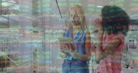 Two Diverse Business Women Analyzing Digital Financial Data