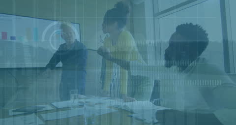 Team Analyzing Financial Data on Interactive Screen