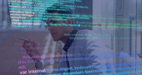Man speaking into smartphone with code overlay reflecting on glass in modern office