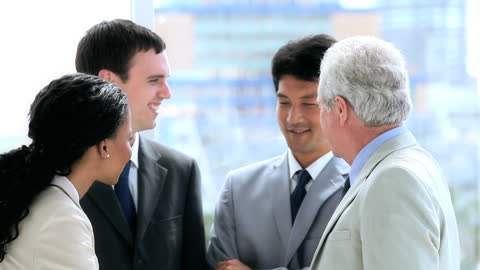 Multiracial Business Team Talking in Bright Office