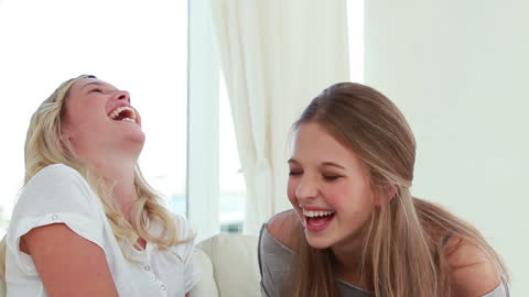 Joyful Friends Laughing Together at Home