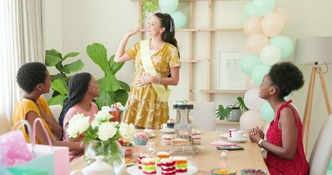 Diverse Female Friends Celebrating with Cupcakes at Home