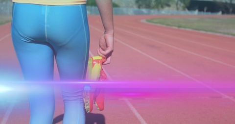 Athletic woman walking on track with running shoes