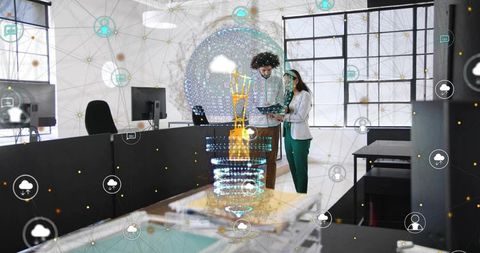 Professionals collaborating with augmented reality hologram and cloud network in open office