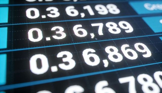 Close-up LED numeric readout displaying glowing decimal rows on blue grid for data visuals