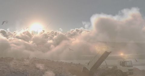 Trucks Unloading Garbage at Sunset with Birds in Flight - Download Free Stock Images Pikwizard.com