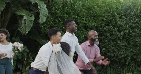 Joyful Celebration at Outdoor Wedding Reception