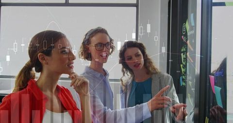 Three team members collaborating at glass wall with data overlay for strategy and analytics