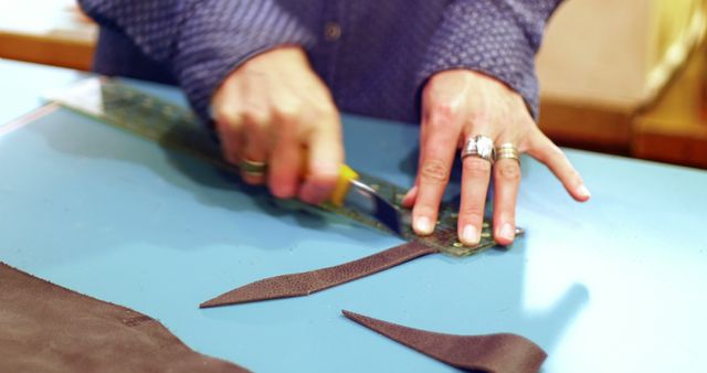 Craftsman Cutting Leather with Precision Utility Knife - Download Free Stock Images Pikwizard.com