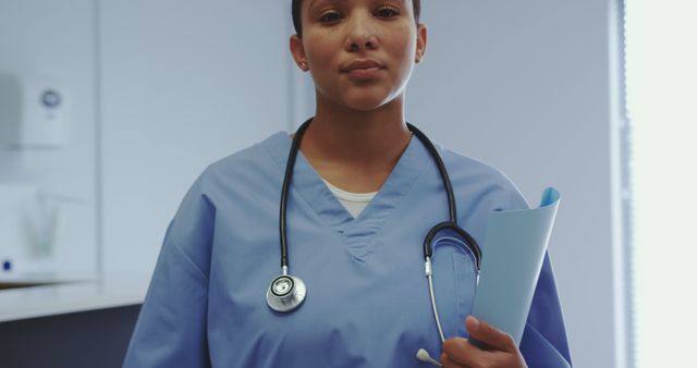 Confident Nurse Holding Medical Documents in Hospital - Download Free Stock Images Pikwizard.com